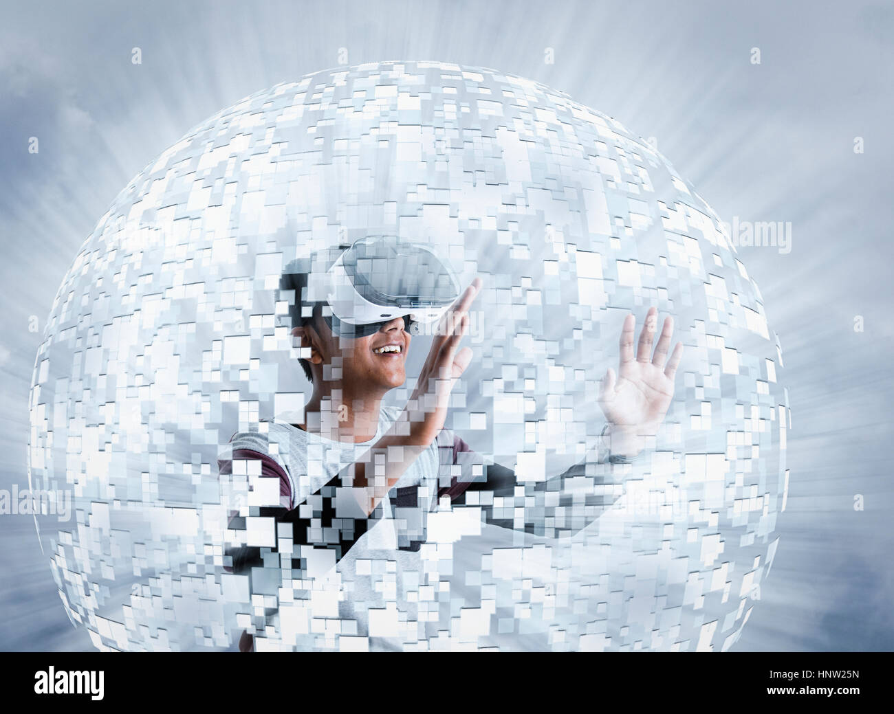 Fiji Indian boy wearing virtual reality goggles in floating sphere Stock Photo
