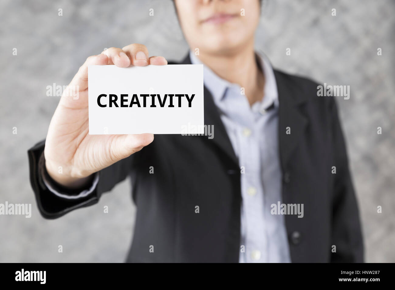 Businessman showing business card with word creativity stock photo alamy