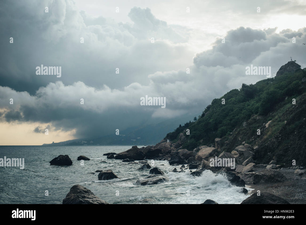 Waves splashing on rocky beach Stock Photo - Alamy