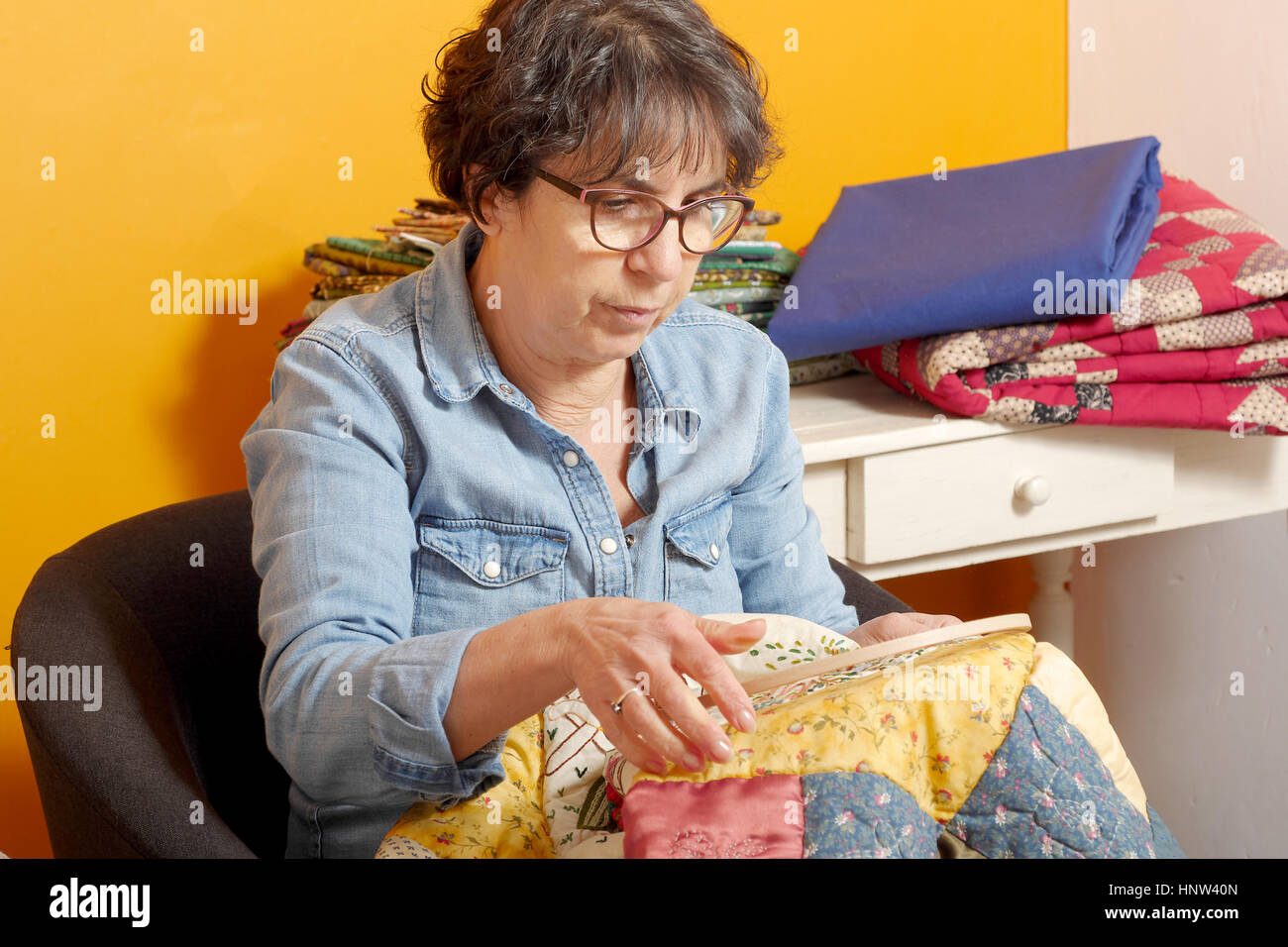 seamstress woman sewing for finish a quilt Stock Photo Alamy