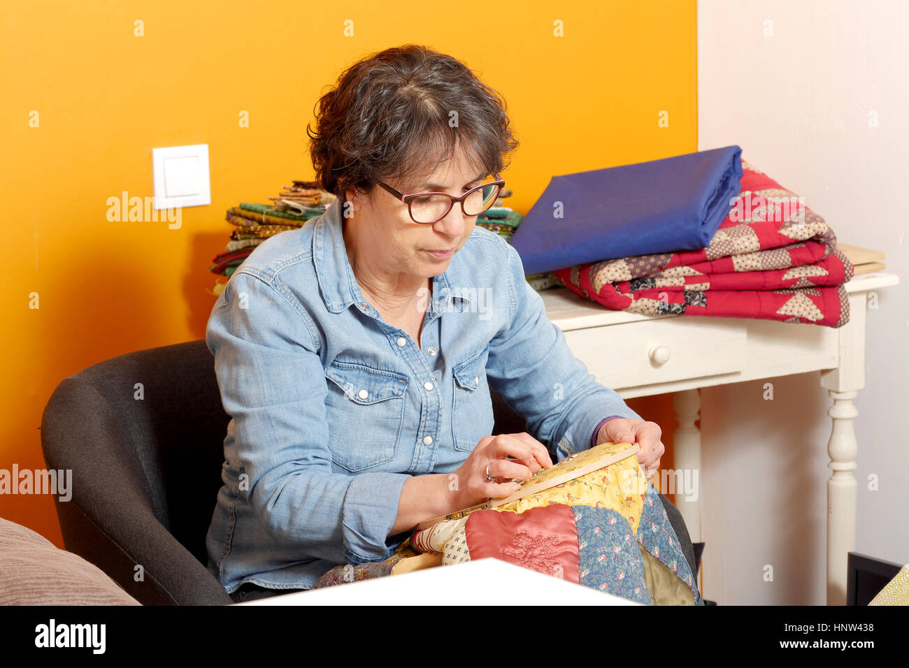 seamstress woman sewing for finish a quilt Stock Photo Alamy