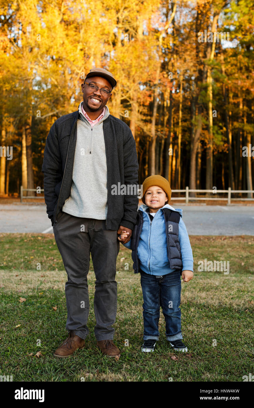 Two boys holding hands hi-res stock photography and images - Alamy