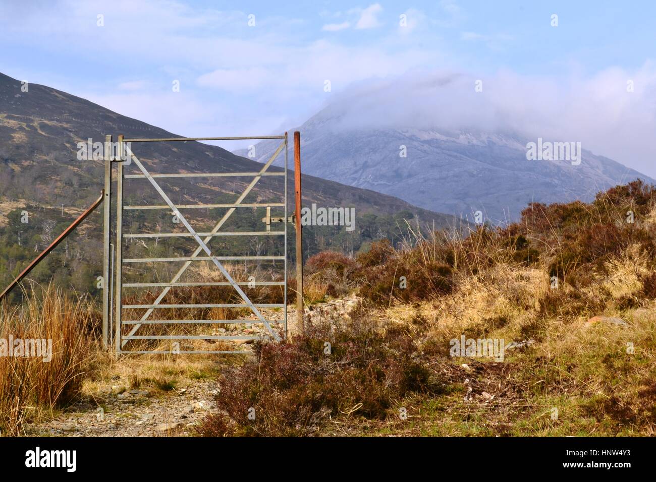 Metal gate standing alone in the Highlands of Scotland Stock Photo