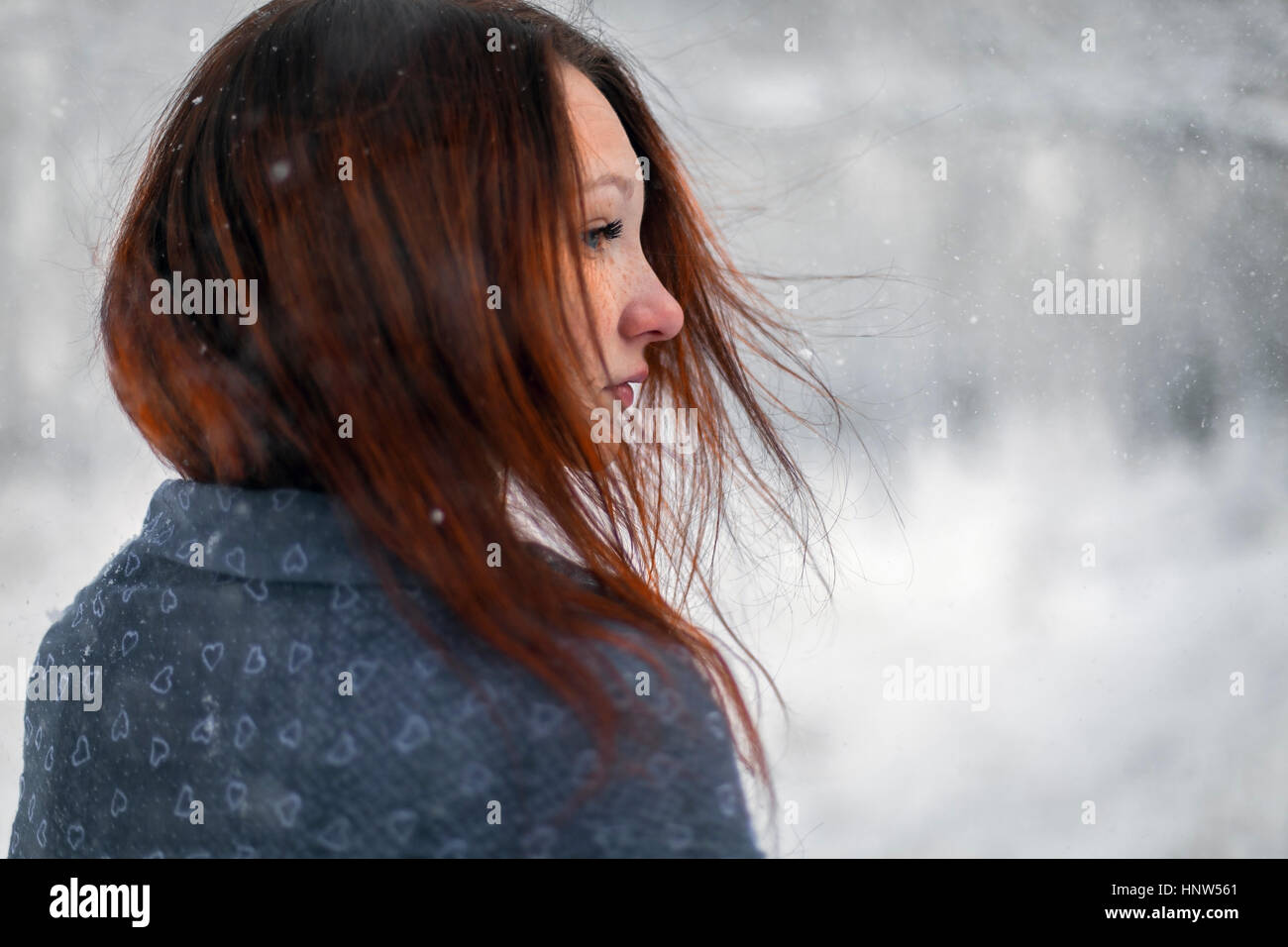 Hair of Caucasian woman blowing in wind in winter Stock Photo