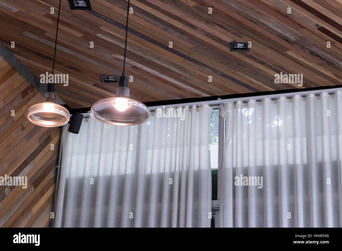 Picture of lantern on skew wooden wall with white curtain Stock Photo - Alamy