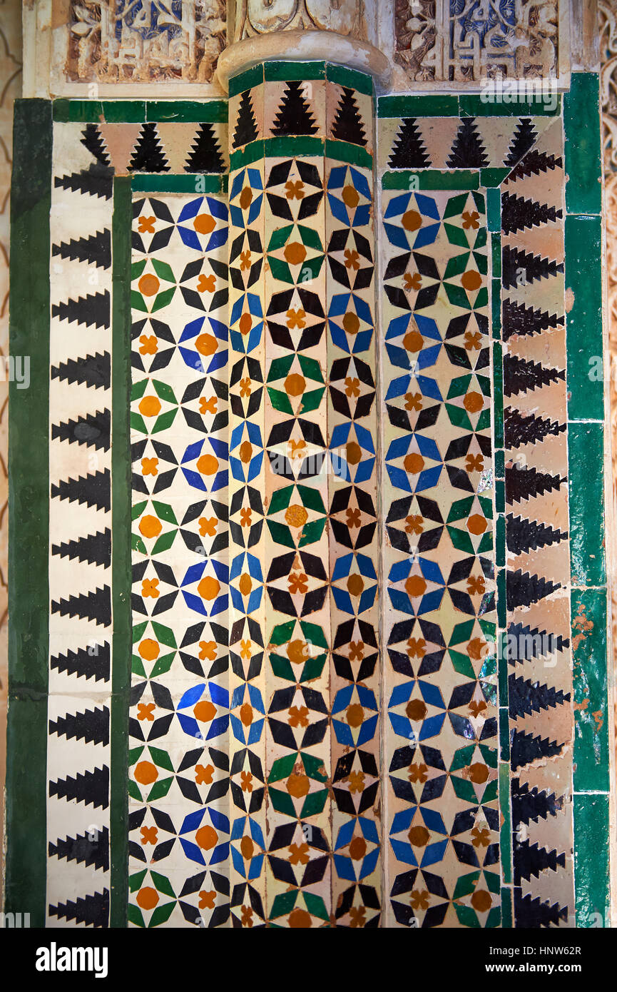 Moorish arabesque ceramic tiles sculpted plasterwork of the Palacios Nazaries,  Alhambra. Granada, Andalusia, Spain. Stock Photo