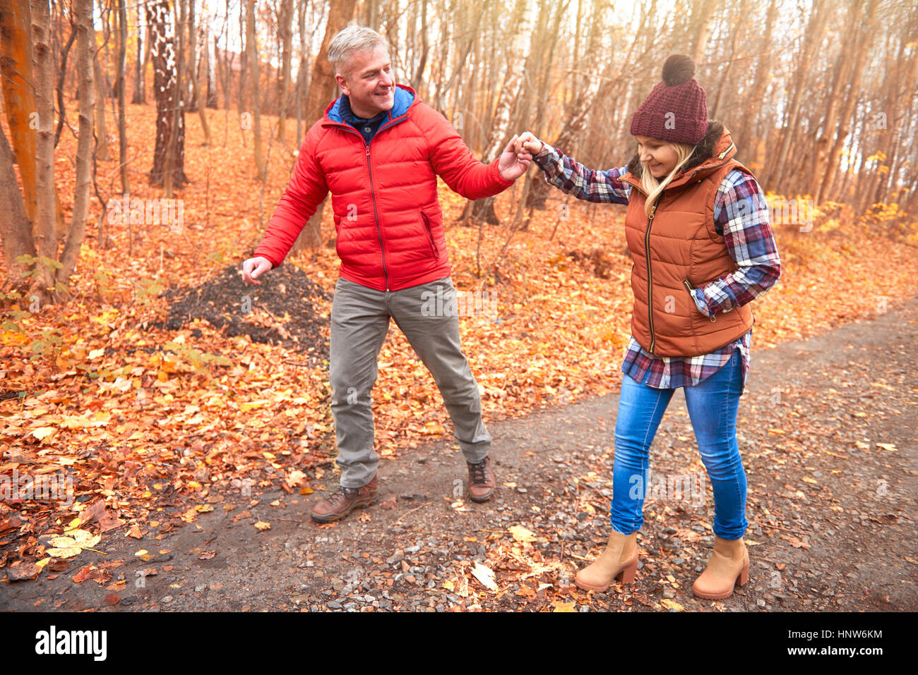 Mature couple walking along rural pathway, in autumn Stock Photo - Alamy