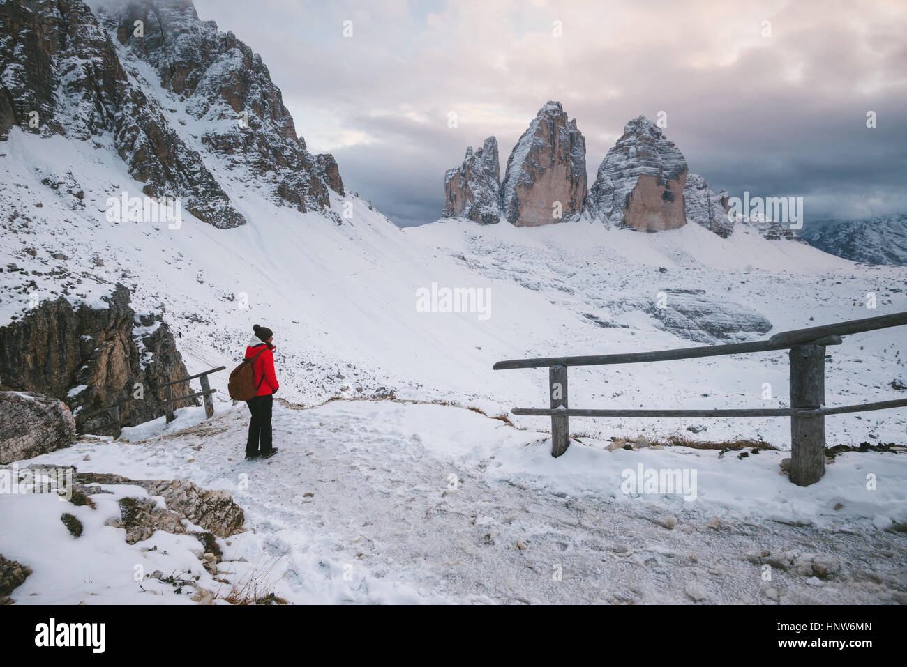 Female hiker looking at view, Tre Cime di Lavaredo area, South Tyrol, Dolomite Alps, Italy Stock Photo