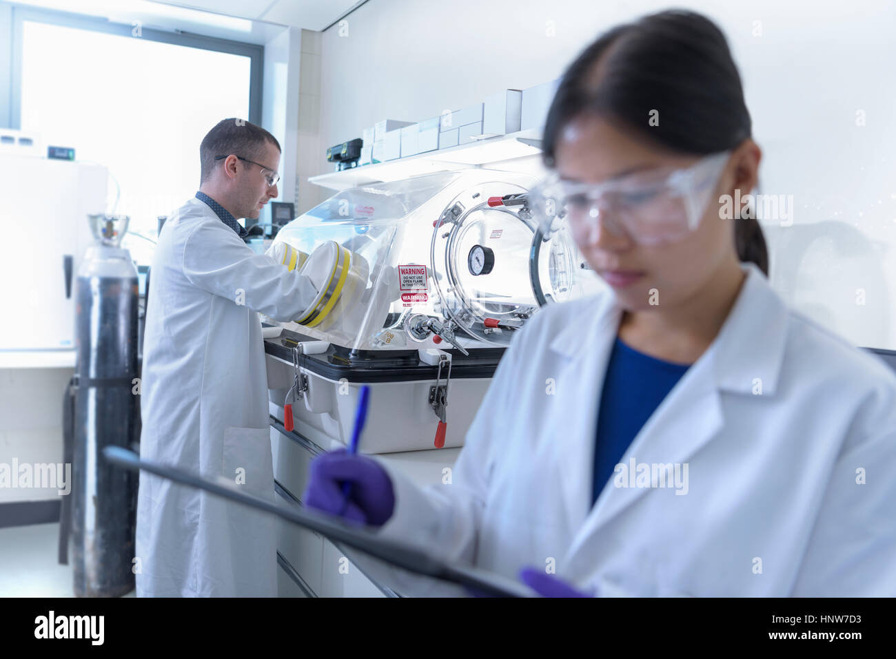Scientists working in crystal engineering research laboratory Stock Photo