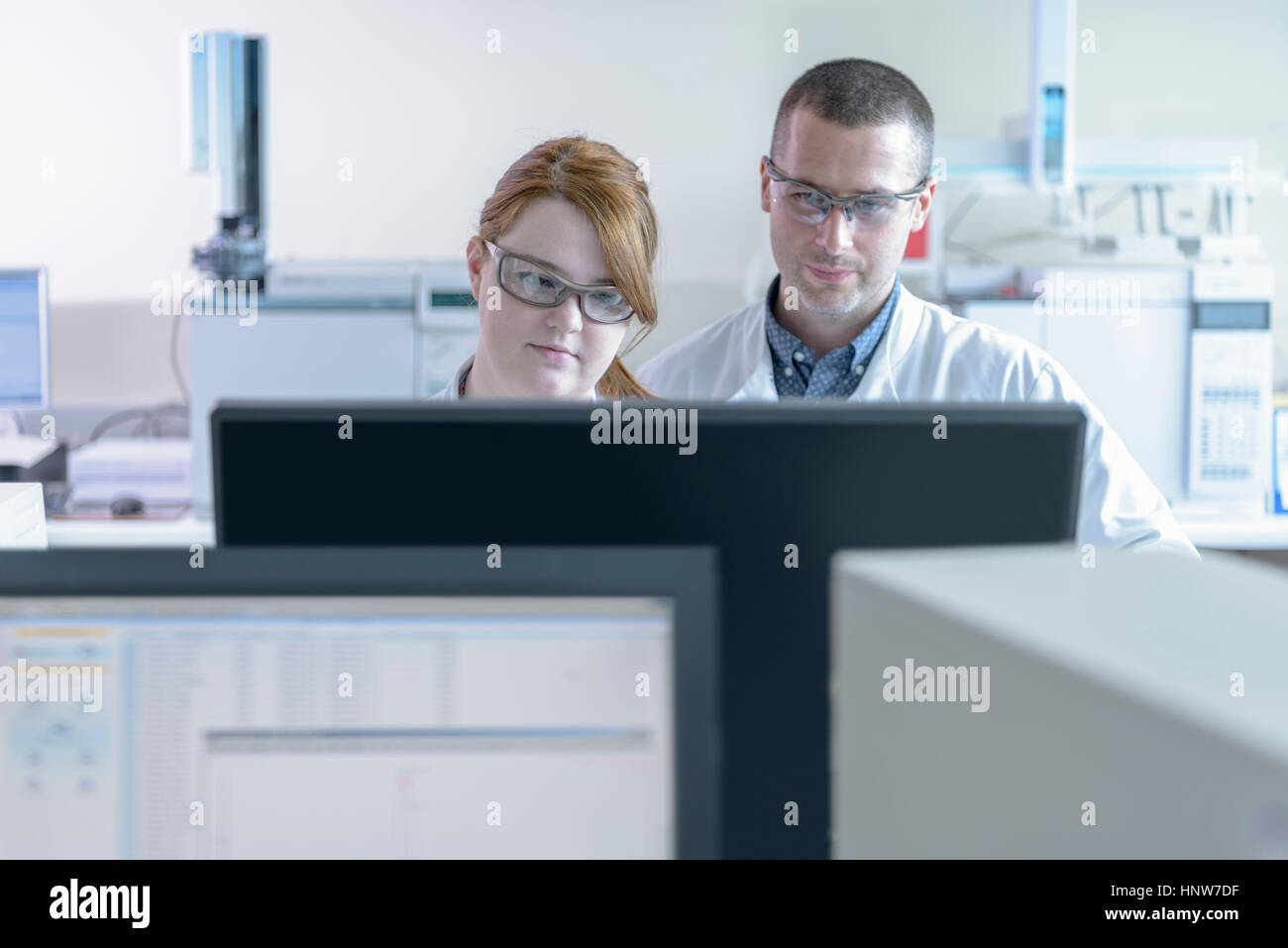 Scientists working in crystal engineering research laboratory Stock Photo