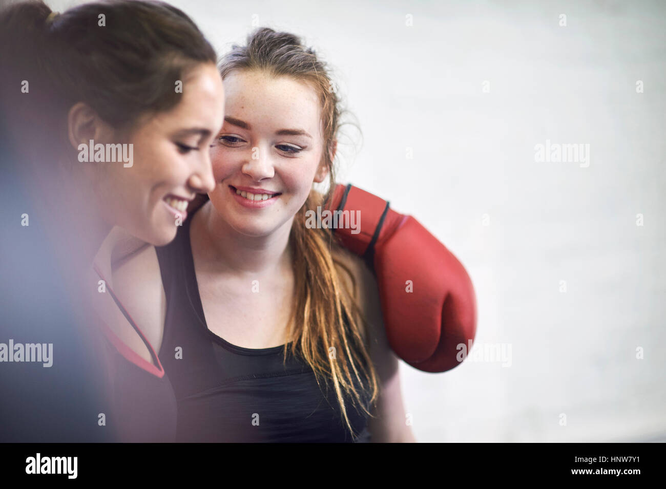 Two young female boxing friends in gym Stock Photo