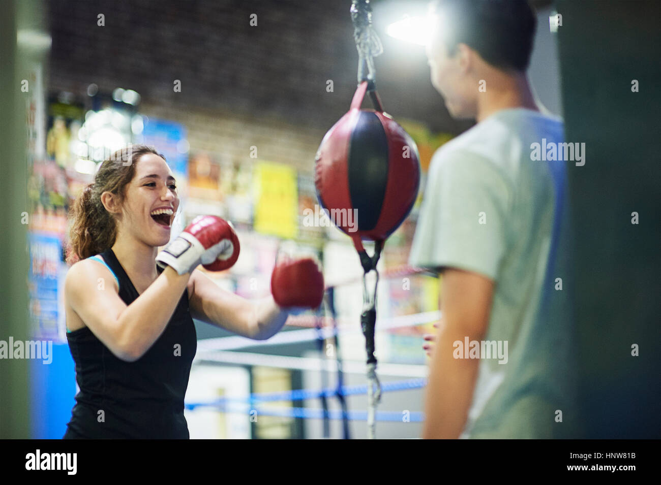 Young female boxer punching speed bag in gym Stock Photo Alamy