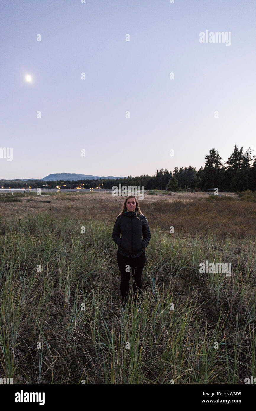 Portrait of woman in marshland, Rathrevor Beach Provincial Park, Vancouver Island, British Columbia, Canada Stock Photo