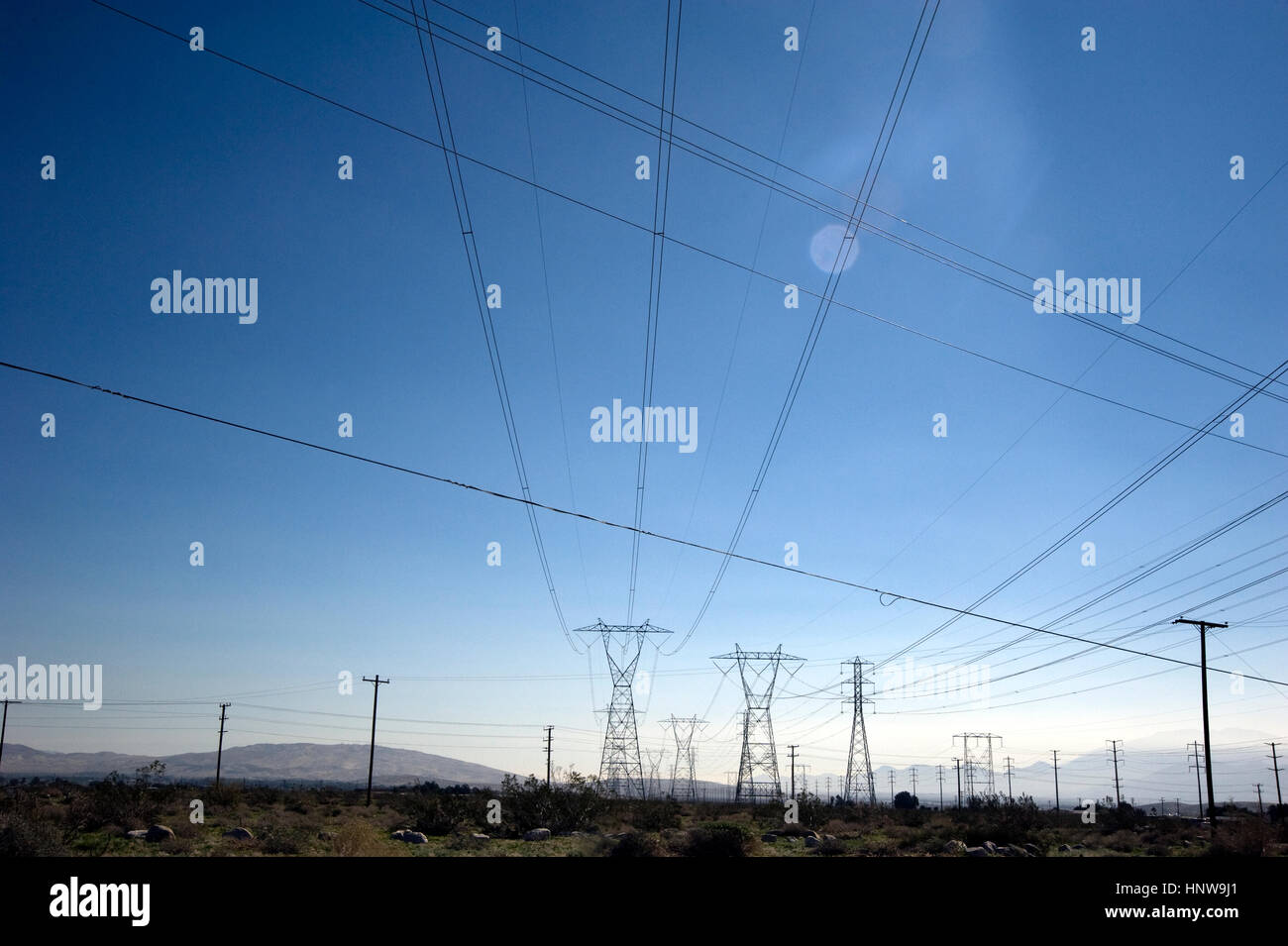Electric wires across desert near Palm Springs, California Stock Photo