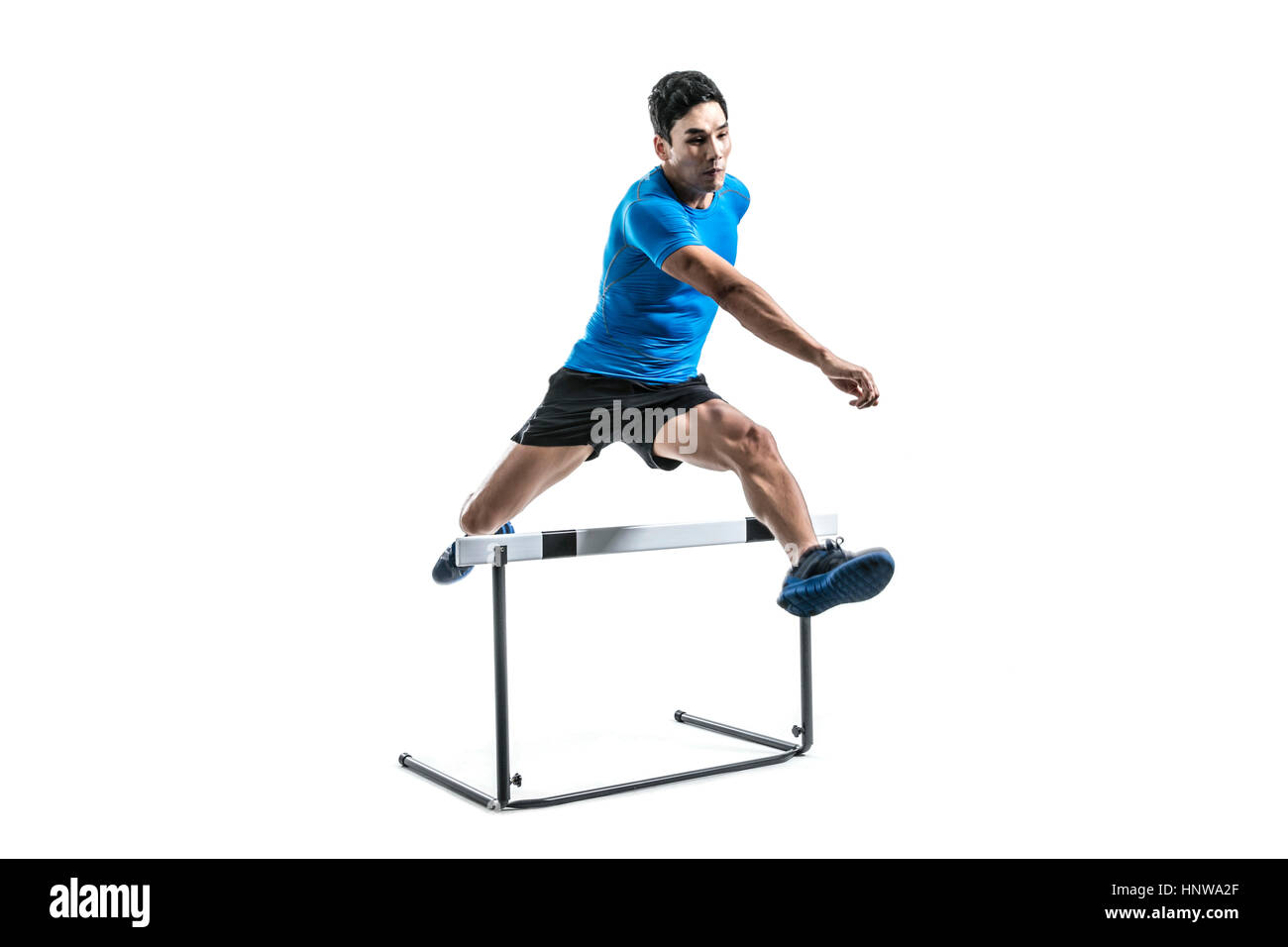 Male athlete jumping over obstacle Stock Photo Alamy