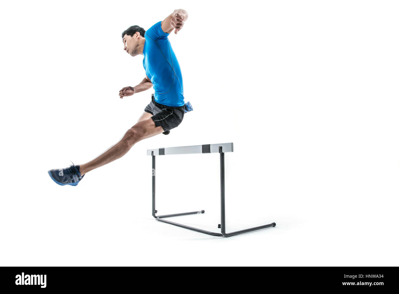Male athlete jumping over obstacle Stock Photo Alamy