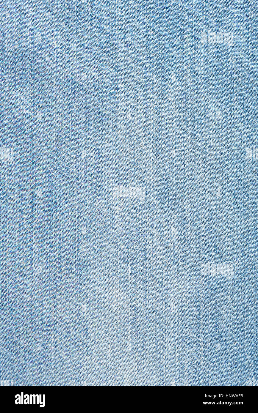 Texture of light blue jeans close up. Blue jeans background Stock Photo