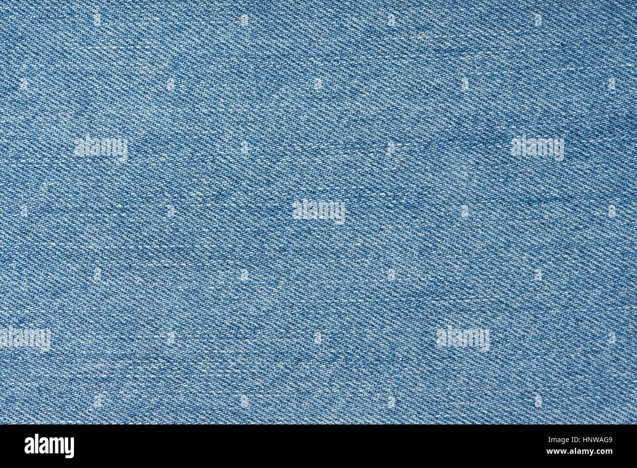texture of light blue jeans macro with horizontal thread Stock Photo