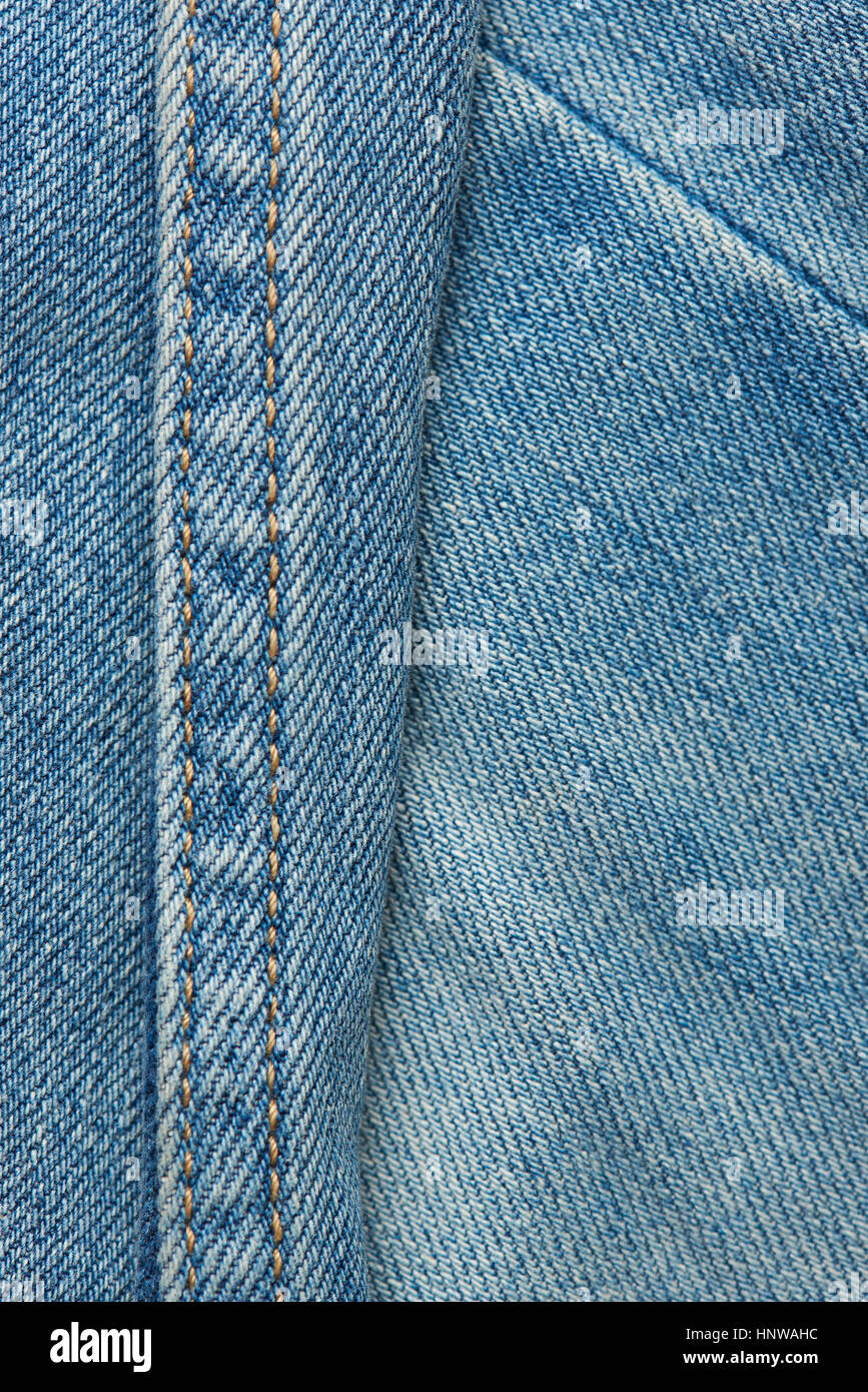 Stitches on light blue textile texture macro close up Stock Photo