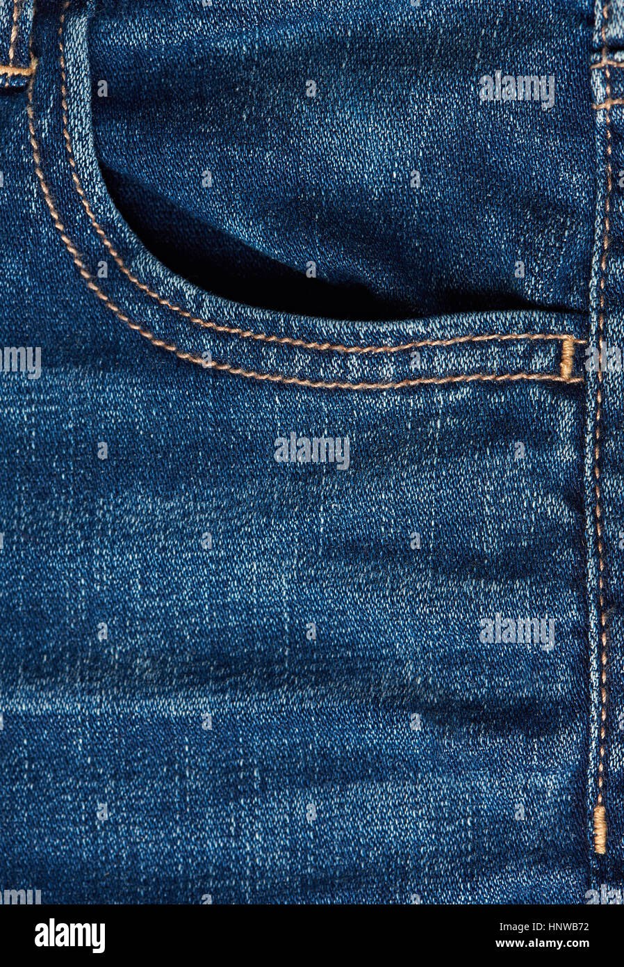 Empty blue jeans front pocket close up. Macro of blue jeans pocket Stock Photo