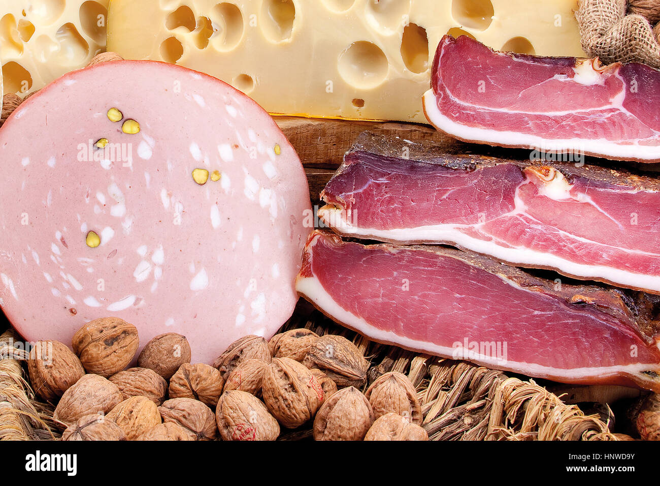 Italian ham, mortadella, Swiss cheese and walnuts in the composition of