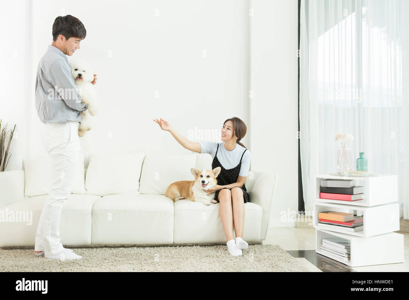 Harmonious couple with pets Stock Photo