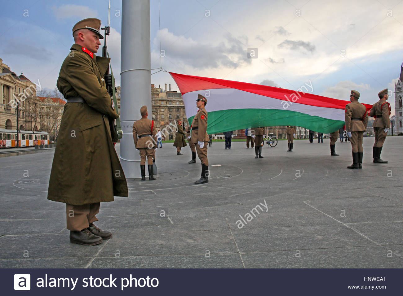 Hungarian guards perform the raising of the national flag ceremony in front of parliament in Budapest, Hungary. Stock Photo
