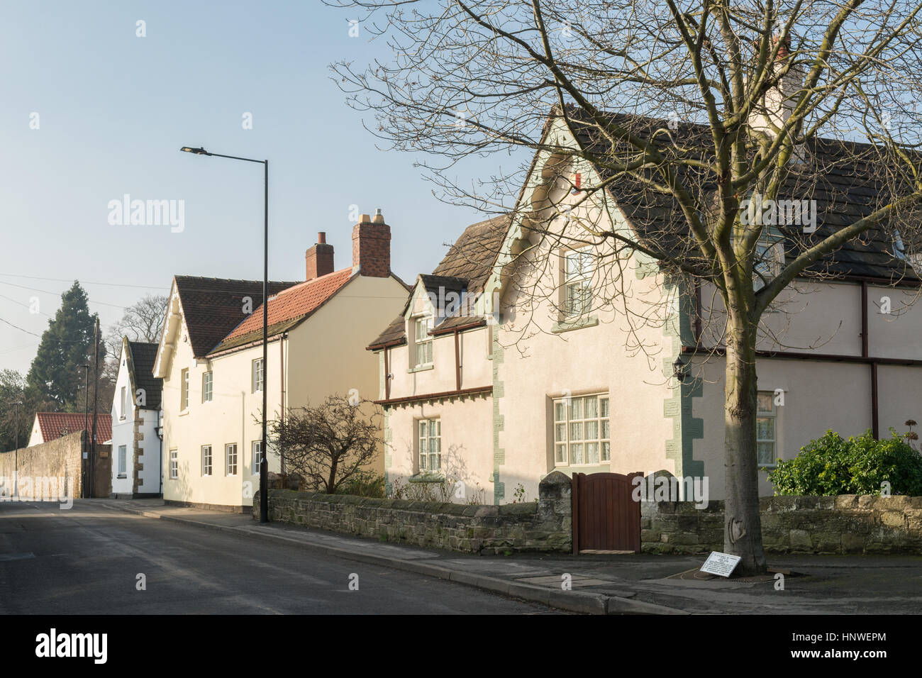 painted cottages with interesting guttering arrangement in South Yorkshire village of Sprotbrough Stock Photo