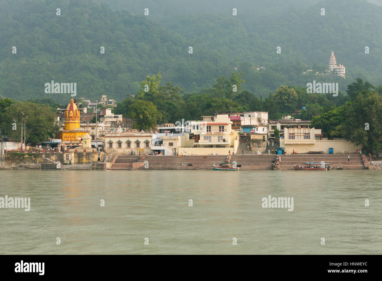 Rishikesh, India - 24 September 2014: Sunset view of bathing ghats near Ram Jhula on the bank of the Ganges, Rishikesh, India on 24 September 2014. Stock Photo