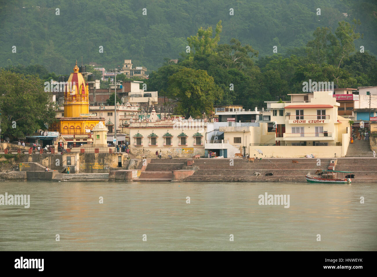 Rishikesh, India - 24 September 2014: Sunset view of bathing ghats near Ram Jhula on the bank of the Ganges, Rishikesh, India on 24 September 2014. Stock Photo