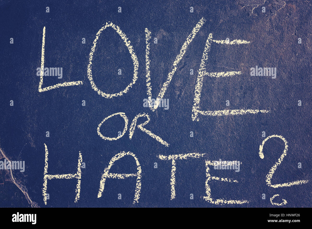 Love or hate chalk drawing, color toning applied, conceptual picture. Stock Photo