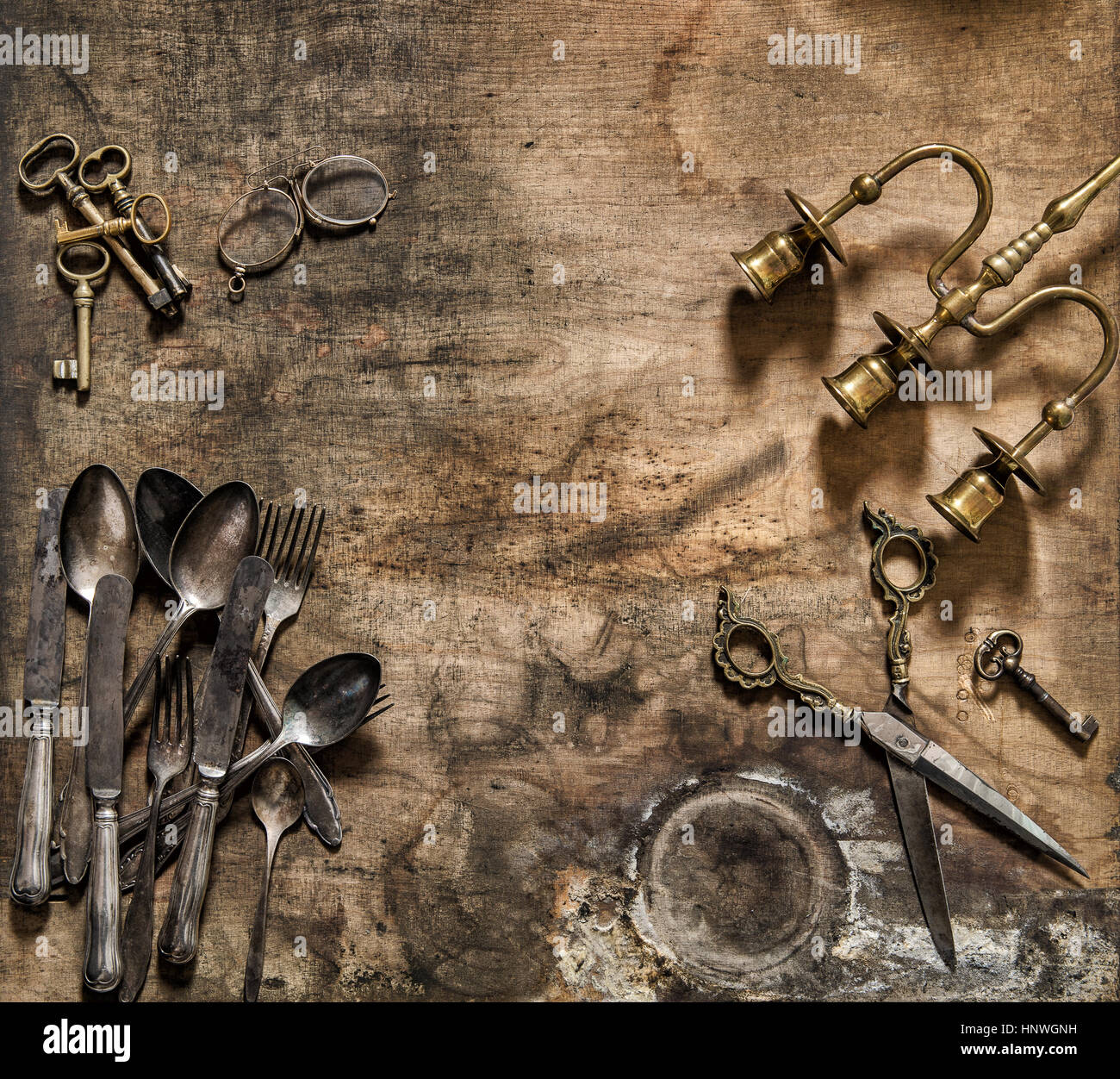 Vintage cutlery, candlestick, scissors, keys. Nostalgic still life flat lay Stock Photo