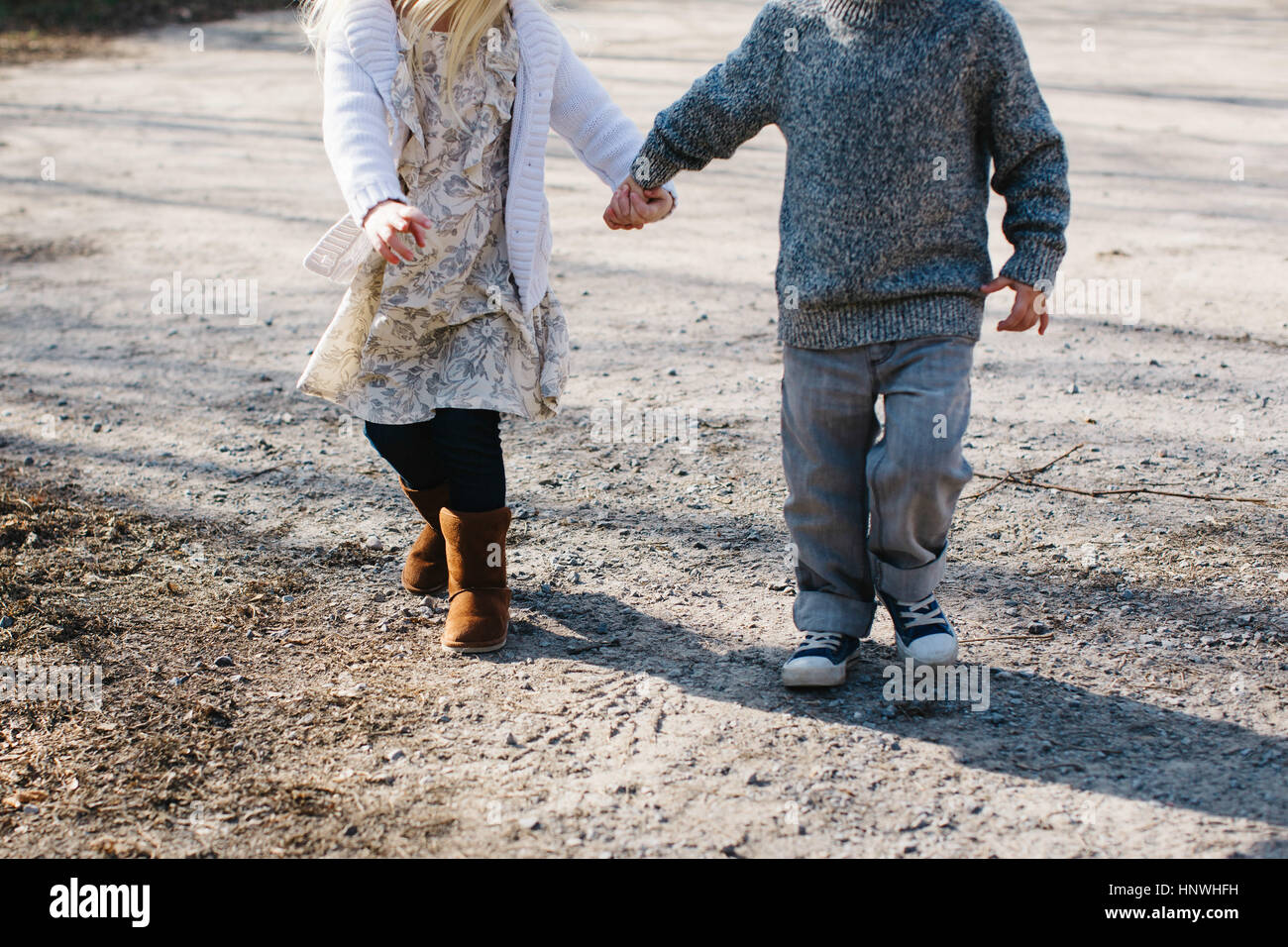 Childhood walking holding hands innocence hi-res stock photography and ...