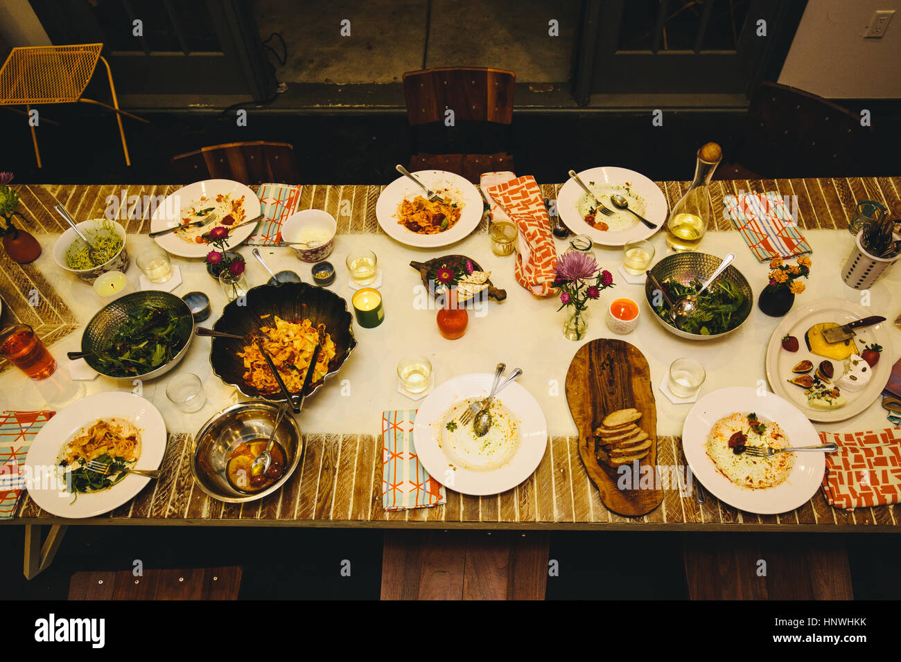 Dining table setting for six, with variety of dishes Stock Photo
