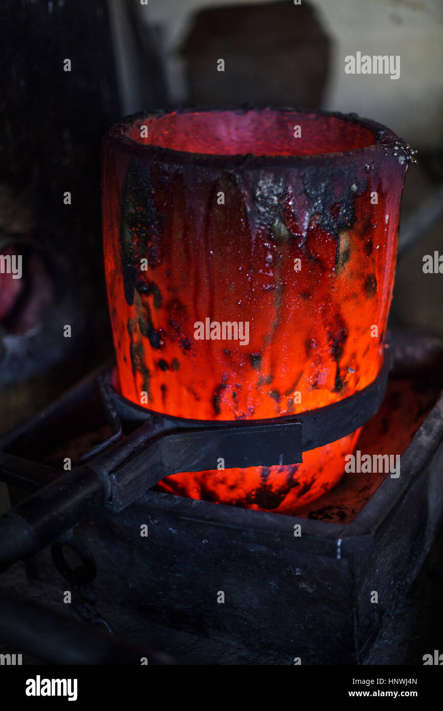 Molten bronze in foundry, close-up Stock Photo