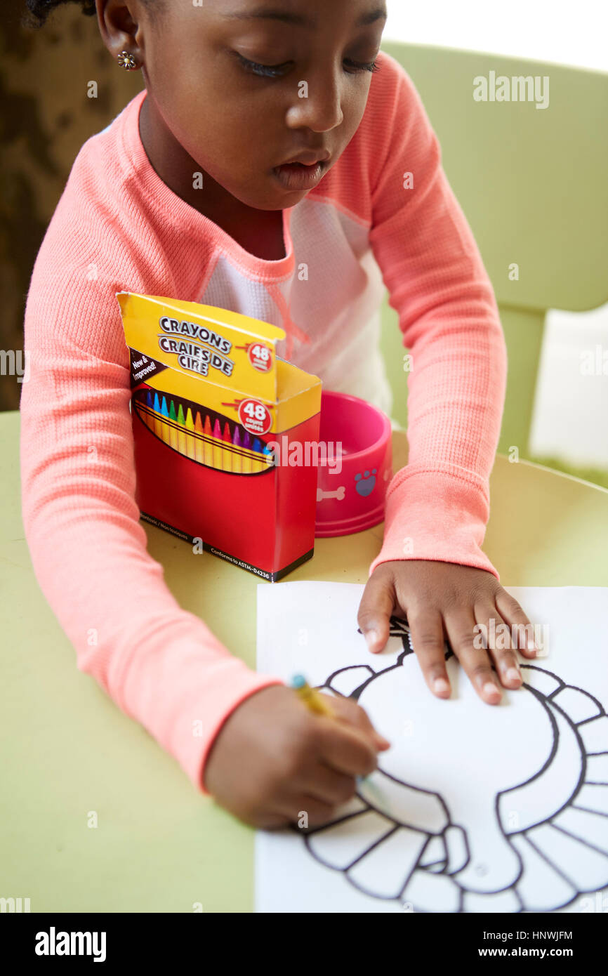 Young girl enjoying colouring in activity Stock Photo