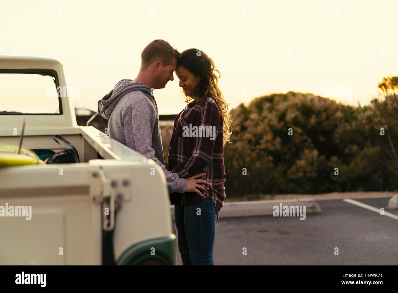 Romantic couple with pickup truck at Newport Beach, California, USA Stock Photo