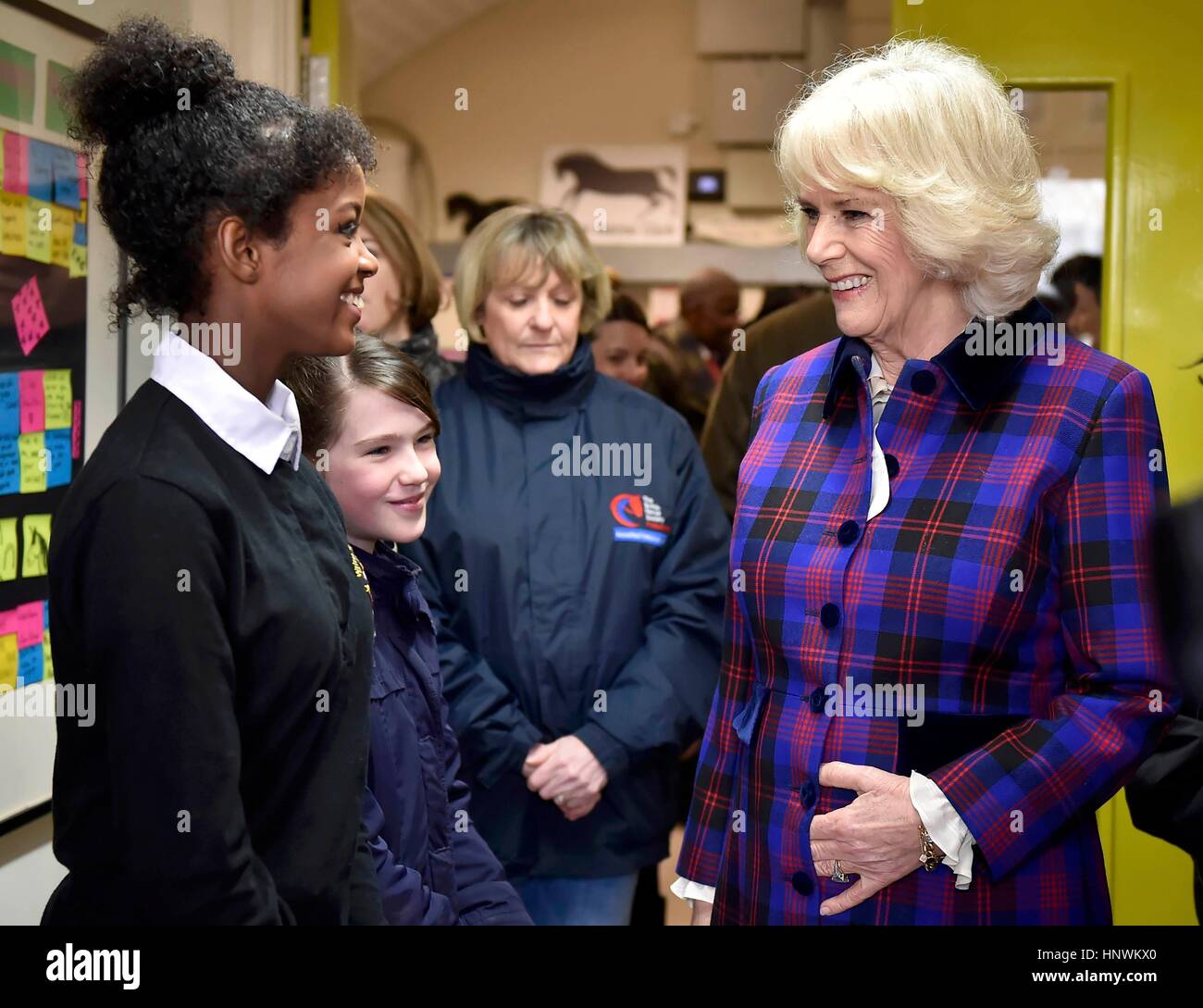 The Duchess of Cornwall, President of the Ebony Horse Club, talks to Natasha Williams, 19, as she visits the charity's Brixton riding centre to celebrate the club's 21st anniversary. Stock Photo
