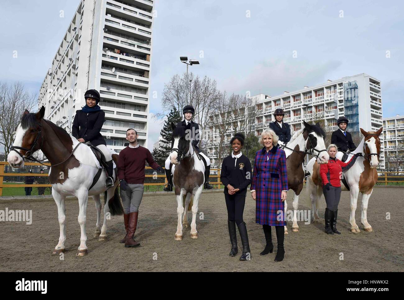 The Duchess of Cornwall, President of the Ebony Horse Club, with Natasha Williams (centre), 19, as she visits the charity's Brixton riding centre to celebrate the club's 21st anniversary. Stock Photo