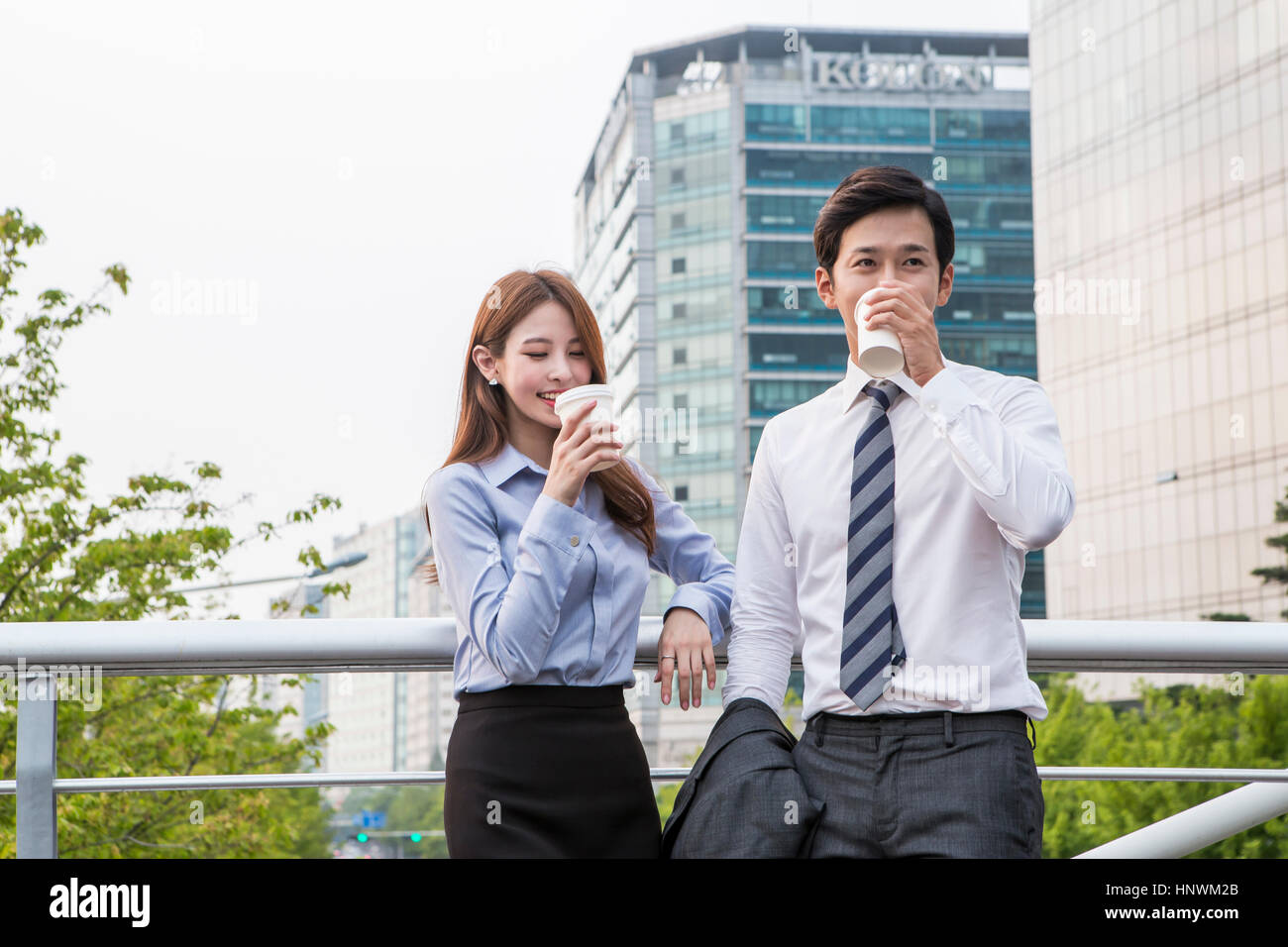 Young smiling business people Stock Photo - Alamy