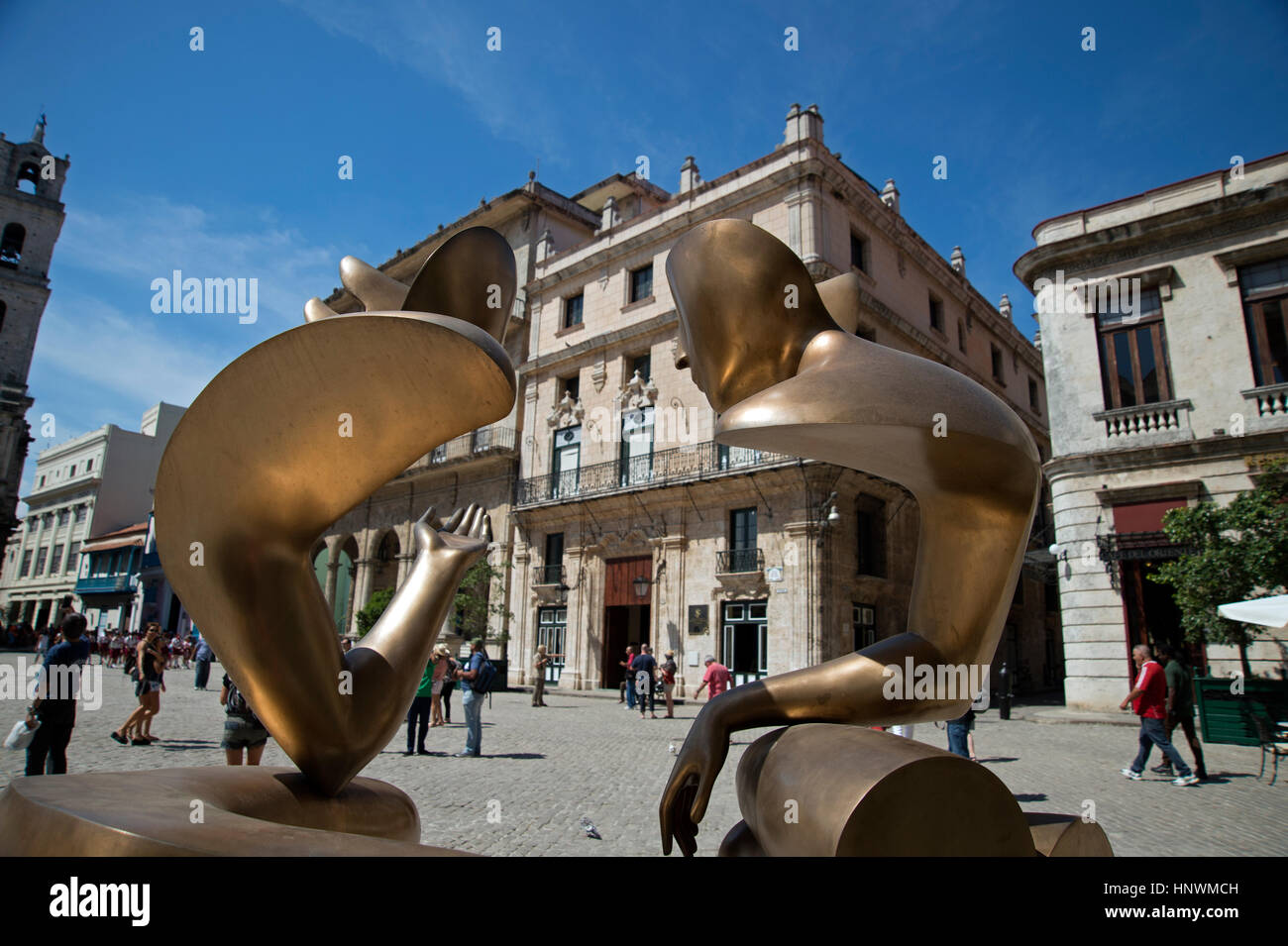 A view of Plaza de San Francisco de Asis through two modern bronze statues in Havana Vieja Cuba Stock Photo