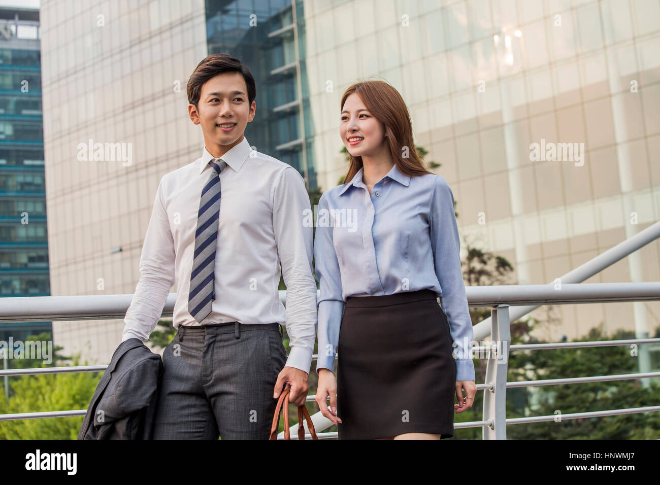 Young smiling business people Stock Photo - Alamy