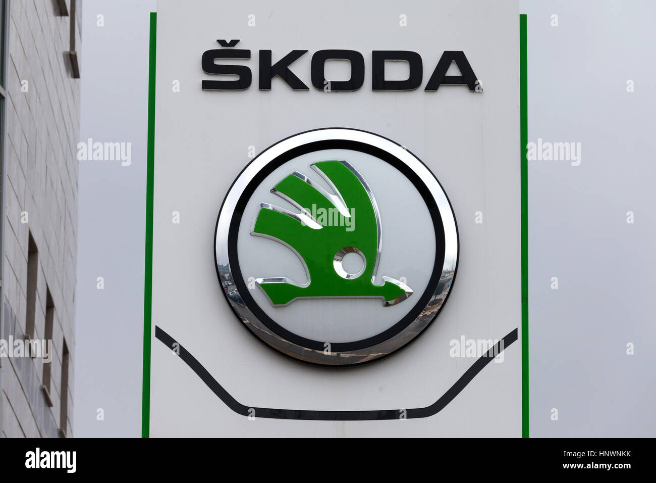 Skoda emblem at one of Skoda's auto dealerships, Skoda became a wholly owned subsidiary of the Volkswagen Group in 2000 Stock Photo