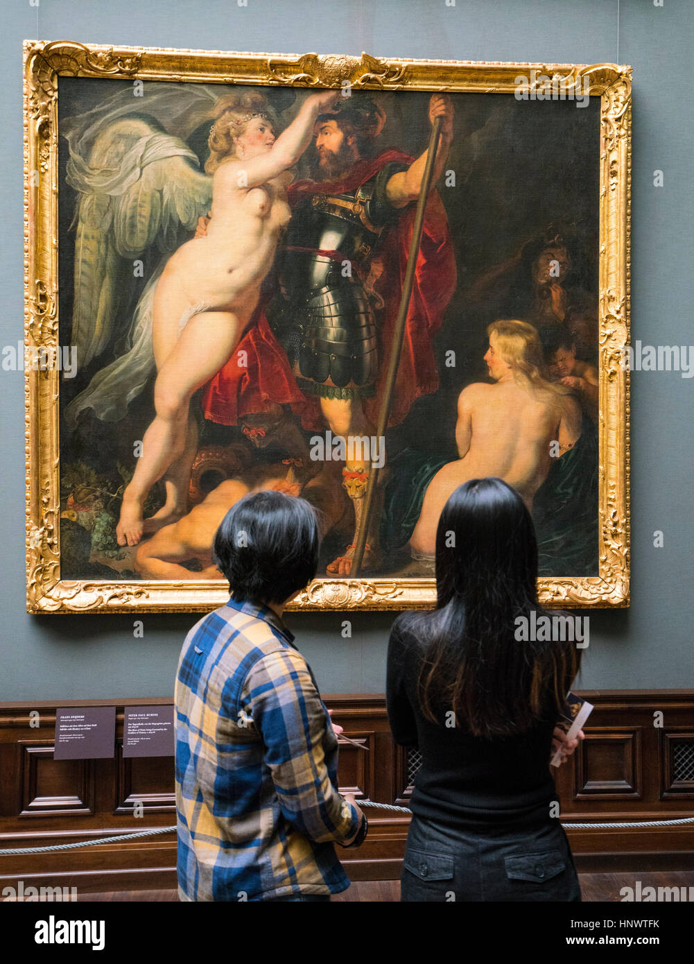 Visitors looking at painting ' The Hero of Virtue being Crowned by the Goddess of Victory' by Peter Paul Rubens at GemŠldegalerie Alte Meister or Zwin Stock Photo