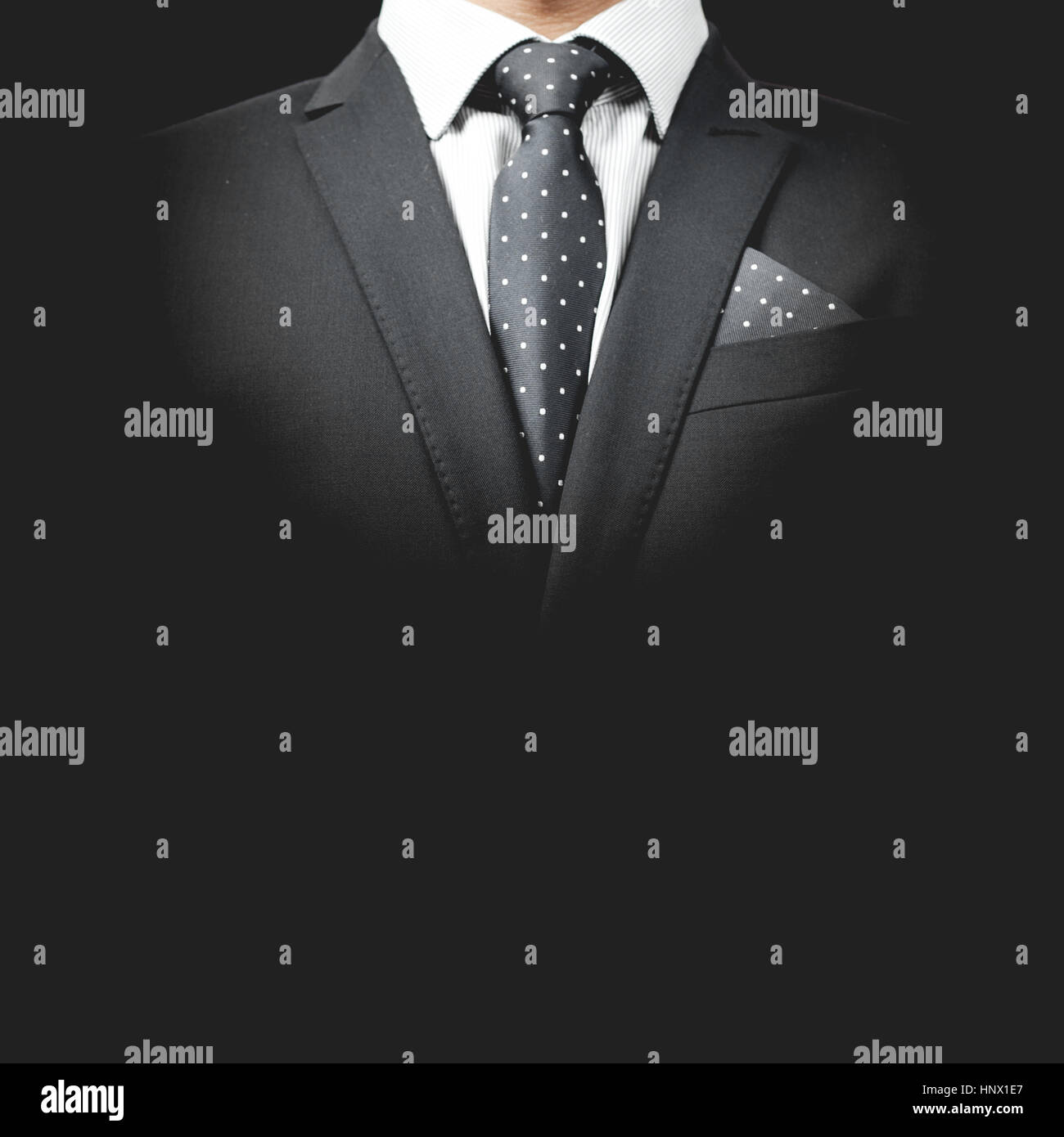 man in suit on a black background Stock Photo - Alamy
