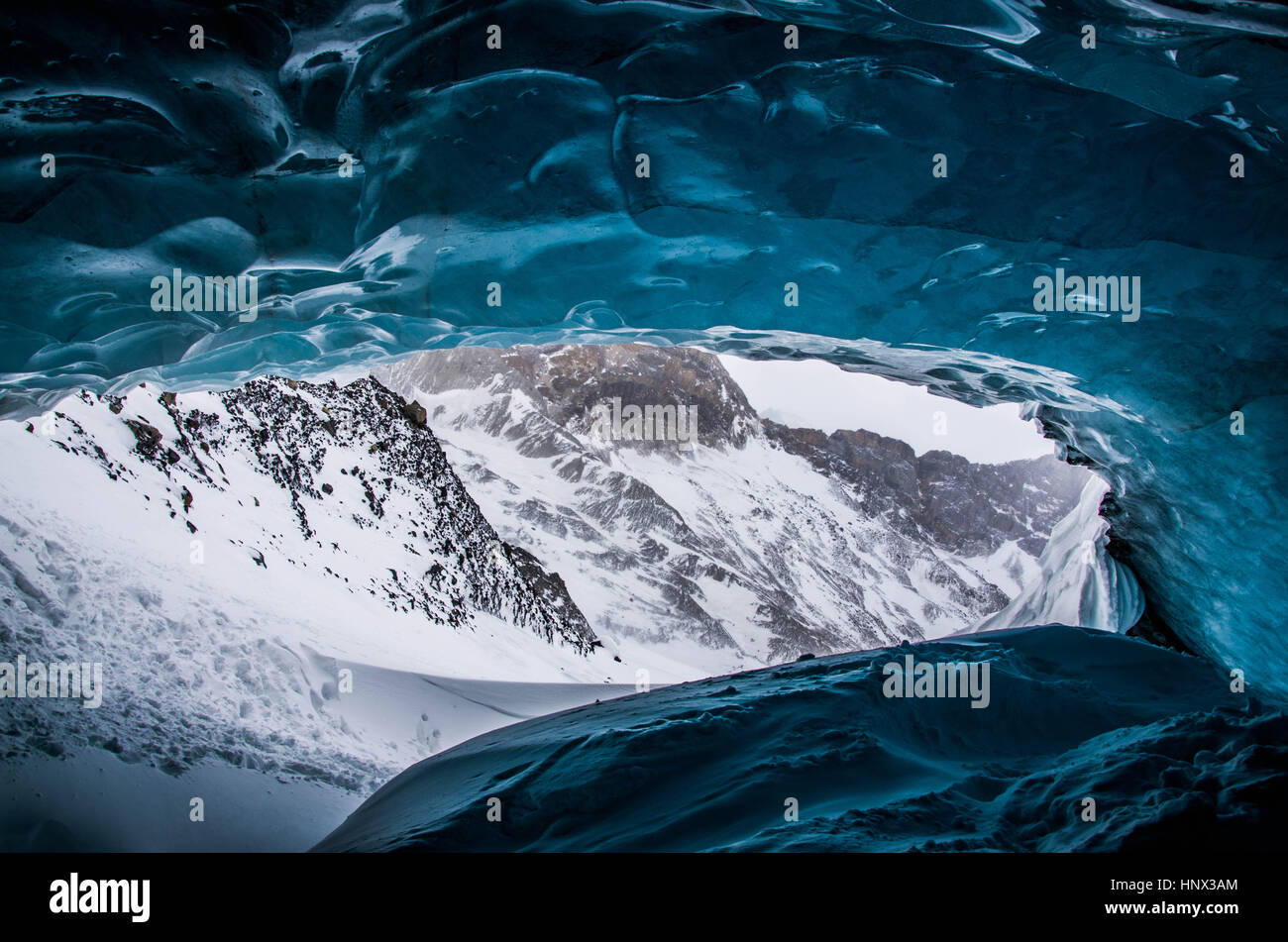 From inside a glacial ice cave in the Canadian rockies Stock Photo