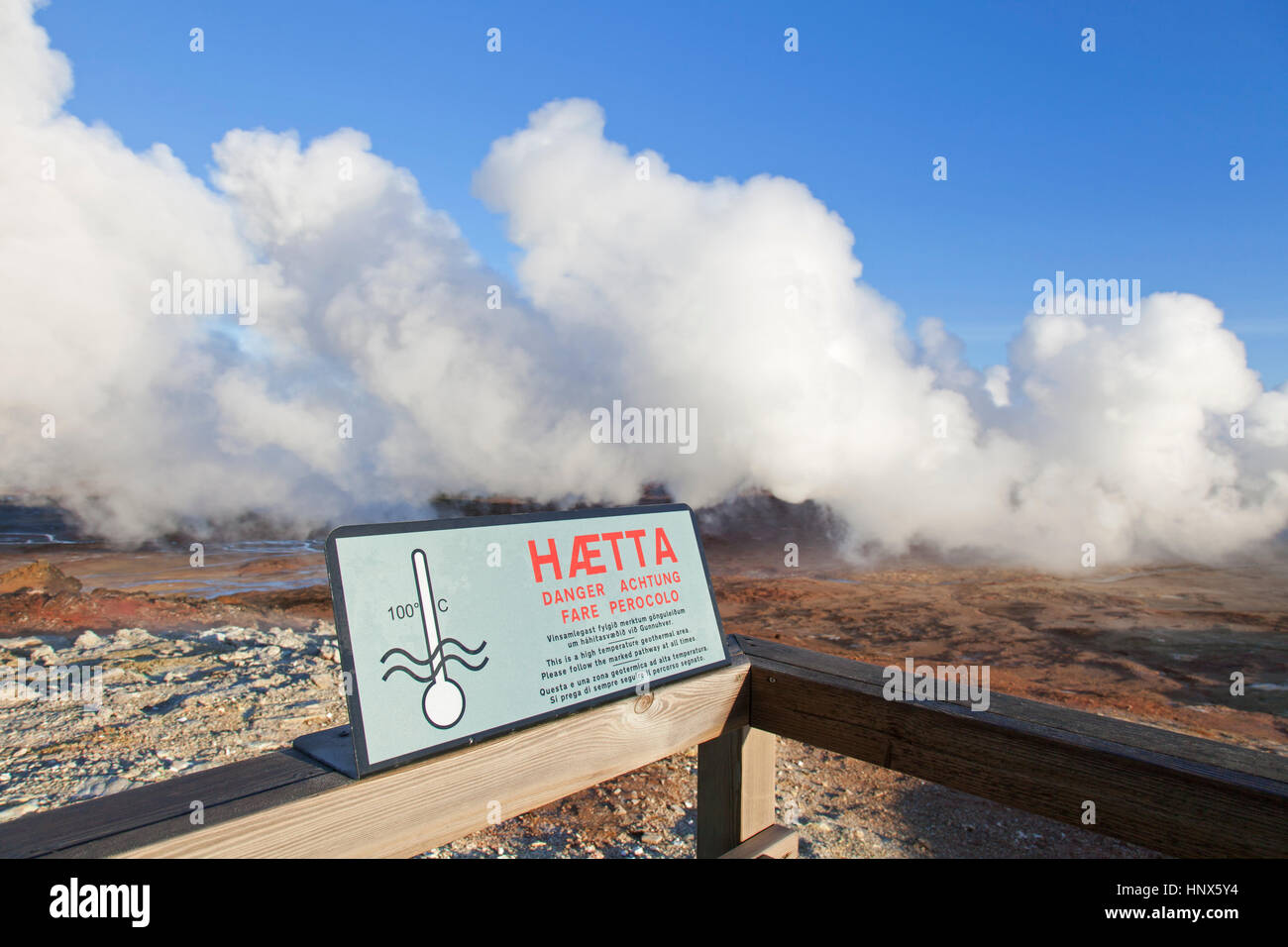 Warning sign and steam vents / fumaroles at Gunnuhver, geothermal area and center of the Reykjanes Volcanic System, Iceland Stock Photo