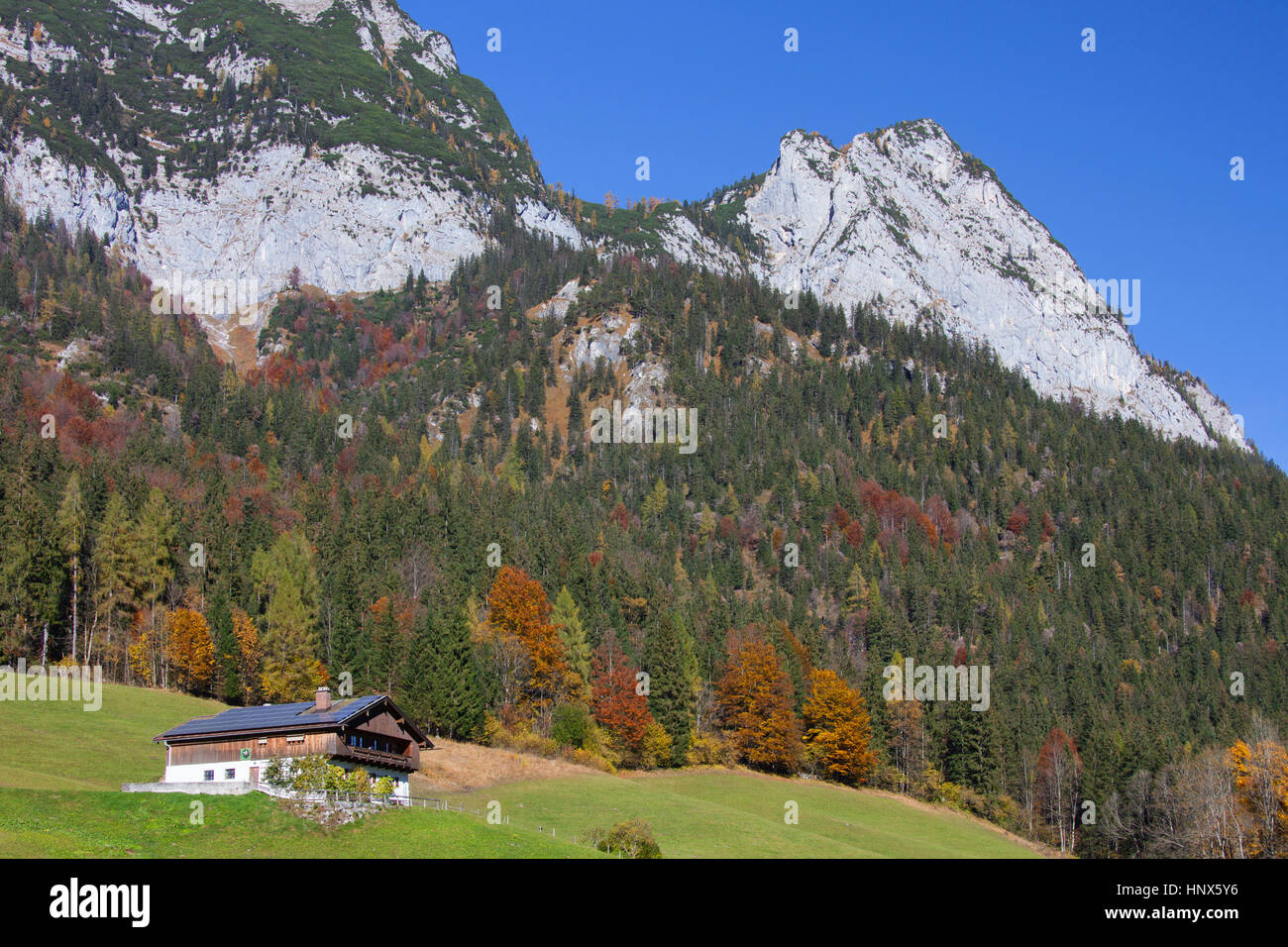 Traditional house with solar panels on roof near Hintersee at Ramsau, Berchtesgadener Land, Upper Bavaria, Germany Stock Photo