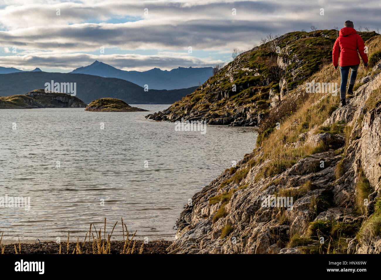 Woman hiking on Sommaroy Island in autumn, Arctic Norway Stock Photo