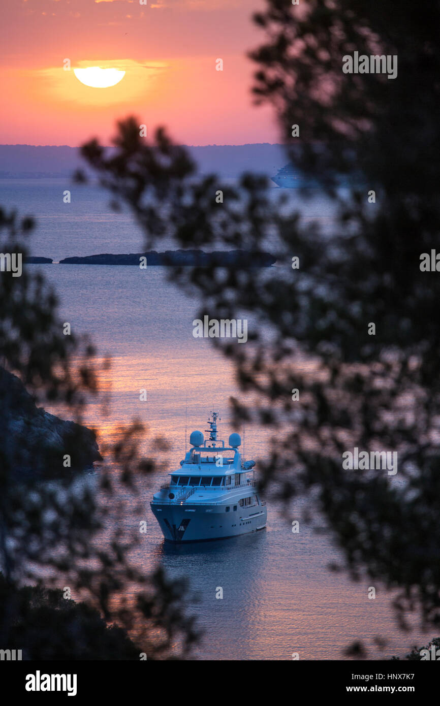Yacht anchored off coast at sunset, Calvia, Majorca, Spain Stock Photo